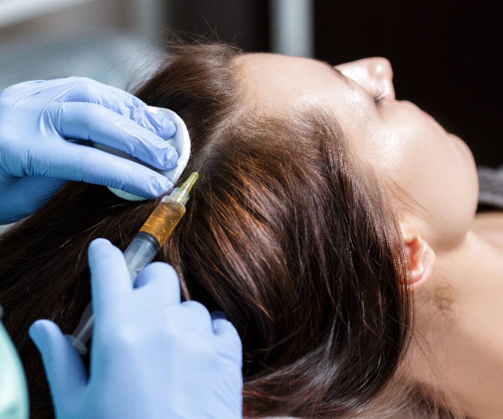 Needle mesotherapy cosmetic been injected in womans head to s jpg