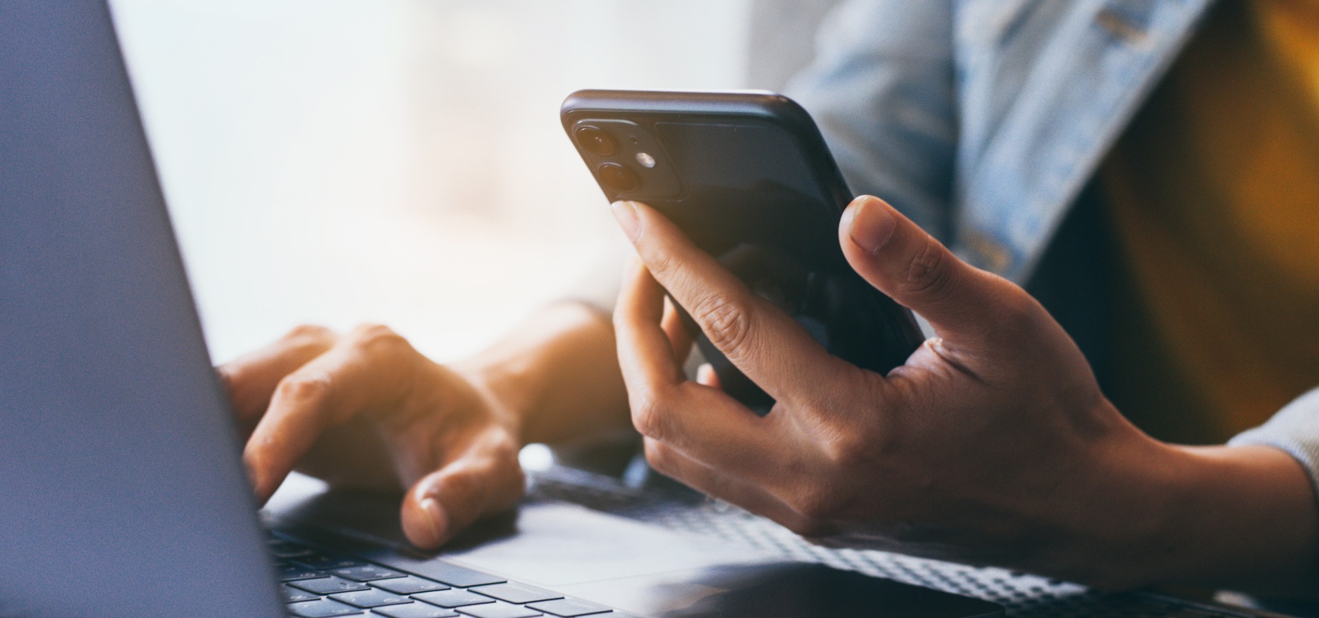 Work using texting cell phone typing computer chatting on mobilelaptop contact us at workplace thinking investment plan investor searching information internet connecting people concept jpg